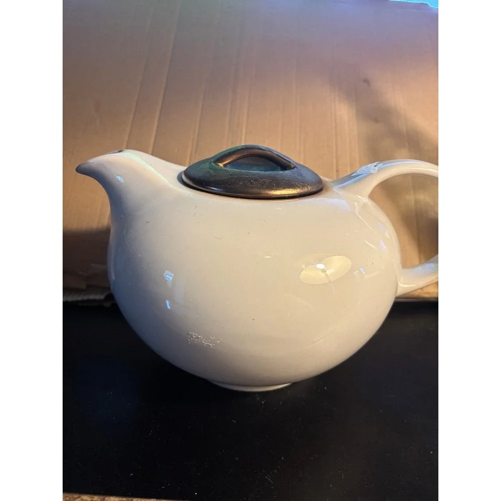 Vintage look stoneware Teapot With Bronze Colored Lid.
